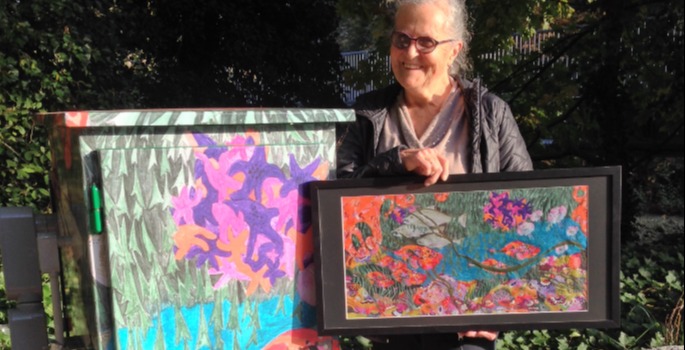 Artist with artwork